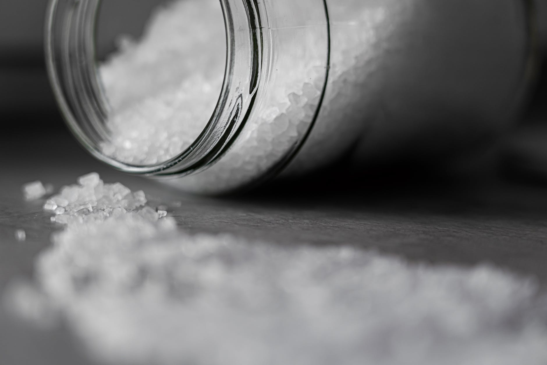 selective focus photo of salt in glass jar