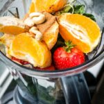 Healthy fruits in a smoothie blender