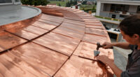 Copper Shingles Wrap Curving Concert Hall ‘La Source Vive’ In éVian, France